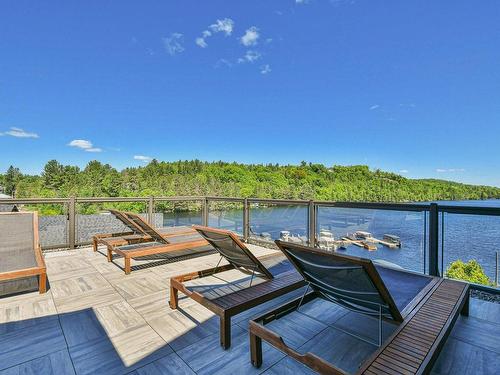 Patio - 302-50 Ch. Masson, Sainte-Marguerite-Du-Lac-Masson, QC - Outdoor With Body Of Water With Deck Patio Veranda