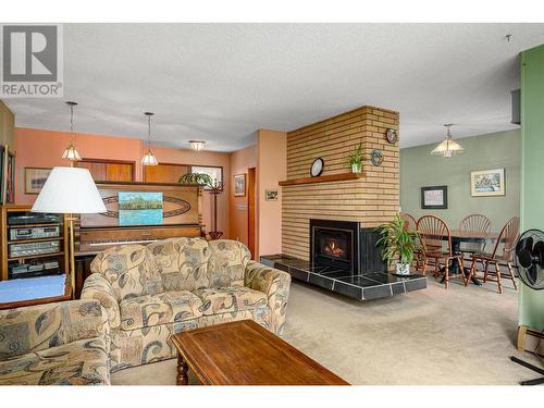 8201 Okanagan Landing Road, Vernon, BC - Indoor Photo Showing Living Room With Fireplace