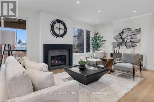 #14 -24 Grapeview Dr, St. Catharines, ON - Indoor Photo Showing Living Room With Fireplace