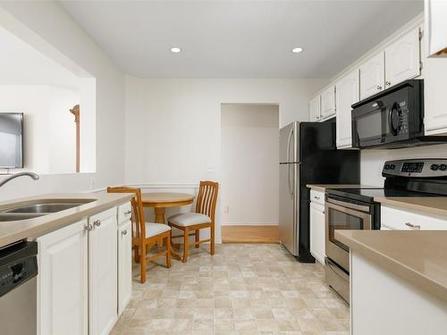 307-1385 Bertram Street, Kelowna, BC - Indoor Photo Showing Kitchen With Double Sink