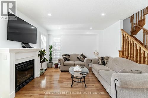 4 Beresford Cres, Brampton, ON - Indoor Photo Showing Living Room With Fireplace