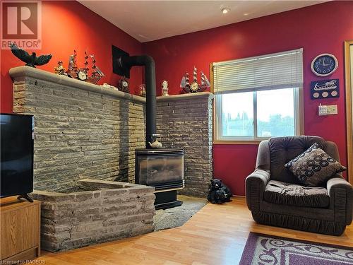 Cozy up in front of the Natural Gas stove - 49 Queen Street E, Hepworth, ON - Indoor Photo Showing Living Room With Fireplace