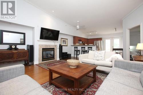#412 -1490 Bishops Gate, Oakville, ON - Indoor Photo Showing Living Room With Fireplace