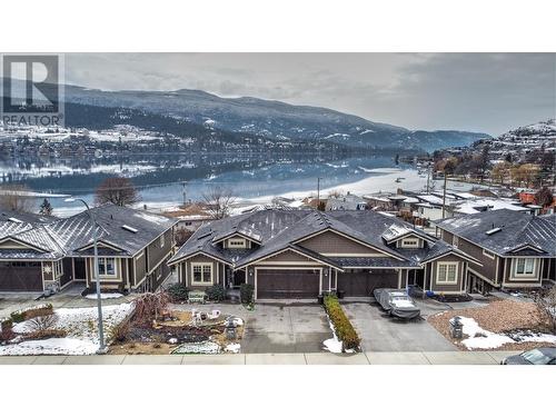 8764 Hofer Drive, Coldstream, BC - Outdoor With Body Of Water With Facade
