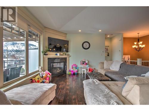 8764 Hofer Drive, Coldstream, BC - Indoor Photo Showing Living Room With Fireplace