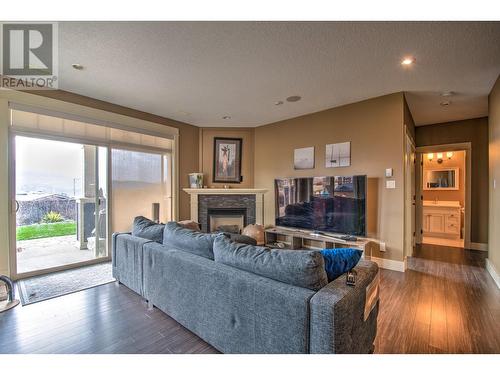8764 Hofer Drive, Coldstream, BC - Indoor Photo Showing Living Room With Fireplace