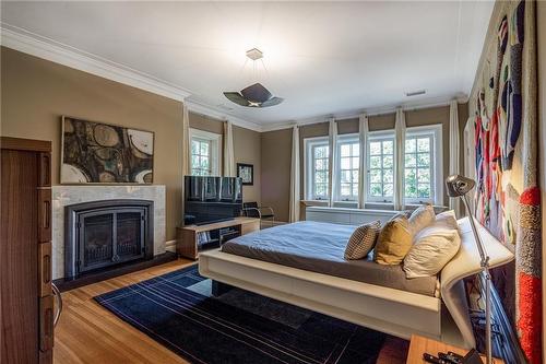 125 Aberdeen Avenue, Hamilton, ON - Indoor Photo Showing Bedroom With Fireplace