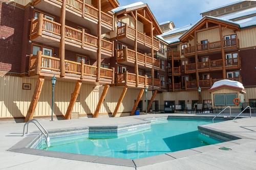 201 - 500 Stemwinder Drive, Kimberley, BC - Outdoor With In Ground Pool