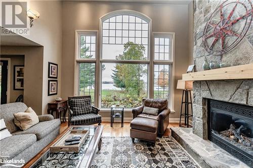 3876 Muskoka 118 Road W Unit# Carling 6-W4, Port Carling, ON - Indoor Photo Showing Living Room With Fireplace