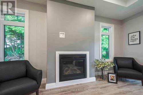 28 Mackenzie John Crescent, Brighton, ON - Indoor Photo Showing Living Room With Fireplace