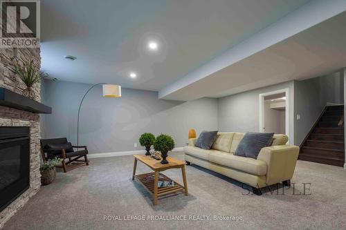 28 Mackenzie John Crescent, Brighton, ON - Indoor Photo Showing Basement With Fireplace