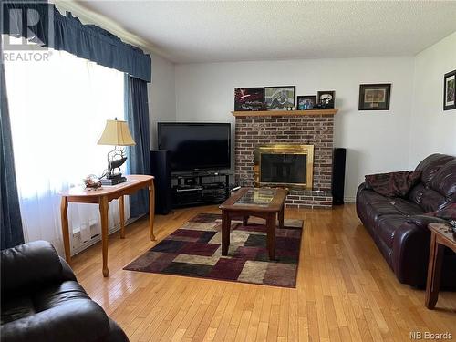 21 Maclaggan Drive, Blackville, NB - Indoor Photo Showing Living Room With Fireplace