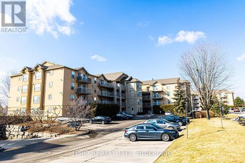 #306 -1450 Bishops Gate, Oakville, ON - Outdoor With Balcony With Facade