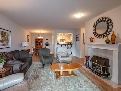 210-1445 Halifax Street, Penticton, BC - Indoor Photo Showing Living Room With Fireplace