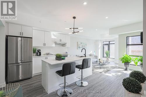 #207 -485 Logan Ave, Toronto, ON - Indoor Photo Showing Kitchen With Stainless Steel Kitchen With Upgraded Kitchen