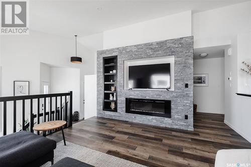 10 Plains Green, Pilot Butte, SK - Indoor Photo Showing Living Room With Fireplace
