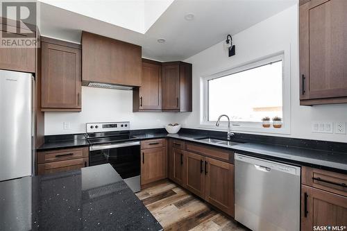 10 Plains Green, Pilot Butte, SK - Indoor Photo Showing Kitchen With Double Sink