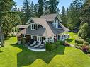 505 Arbutus Bay Rd, Fanny Bay, BC  - Outdoor With Body Of Water With Deck Patio Veranda 