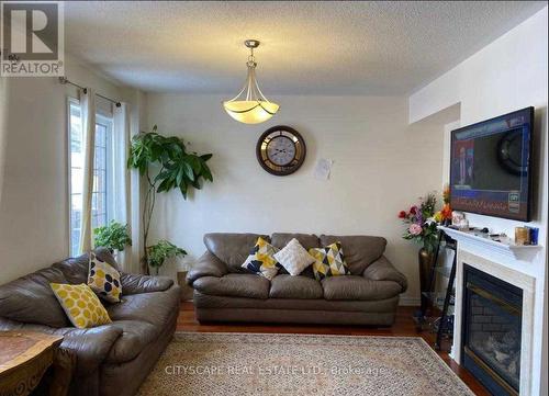 #Main - 30 Sea Lion Road, Brampton, ON - Indoor Photo Showing Living Room With Fireplace
