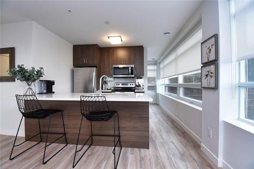 Perfect for Entertaining - 479 Charlton Avenue E|Unit #605, Hamilton, ON - Indoor Photo Showing Kitchen With Stainless Steel Kitchen With Upgraded Kitchen