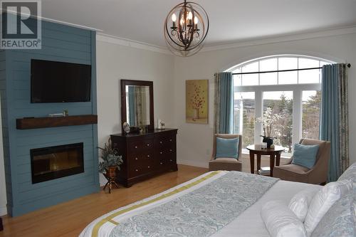651 Old Broad Cove Road, Portugal Cove - St. Philips, NL - Indoor Photo Showing Bedroom With Fireplace
