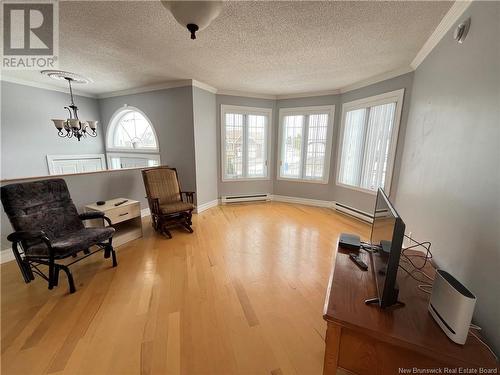 7 Banville Street, Saint-Quentin, NB - Indoor Photo Showing Other Room With Fireplace
