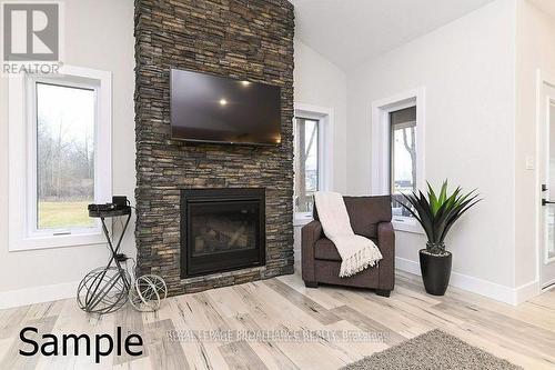 58 Riverside Trail, Trent Hills, ON - Indoor Photo Showing Living Room With Fireplace