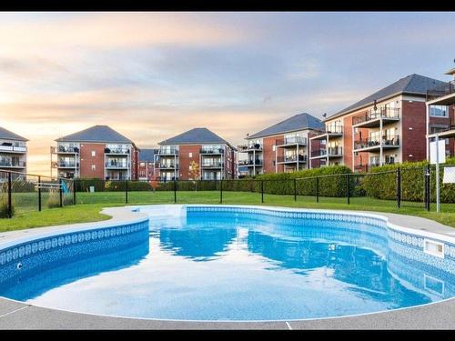 Pool - 4-8940 Crois. Du Louvre, Brossard, QC - Outdoor With In Ground Pool