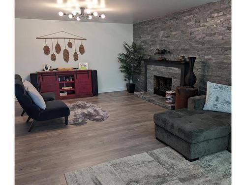 2 Tsitika Cres, Woss, BC - Indoor Photo Showing Living Room With Fireplace