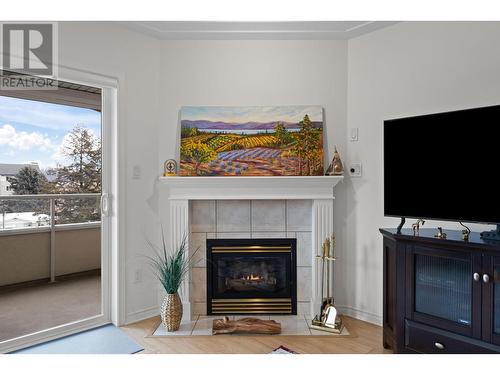 1895 Ambrosi Road Unit# 406, Kelowna, BC - Indoor Photo Showing Living Room With Fireplace
