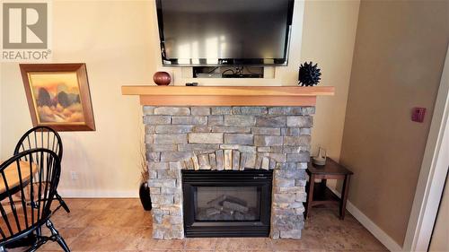 400 Bighorn  Boulevard Unit# 415 G, Radium Hot Springs, BC - Indoor Photo Showing Living Room With Fireplace