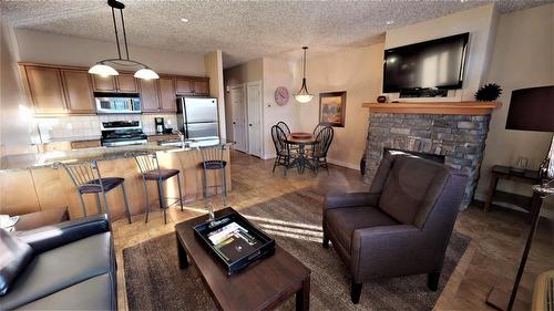 415 G - 400 Bighorn Boulevard, Radium Hot Springs, BC - Indoor Photo Showing Other Room With Fireplace