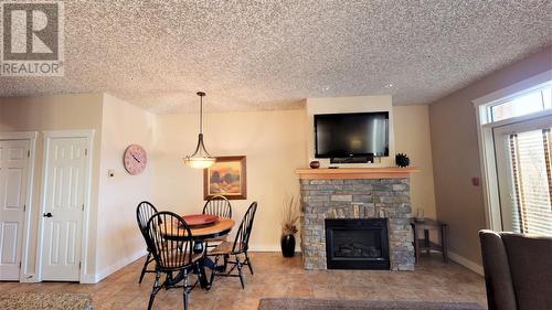 400 Bighorn  Boulevard Unit# 415 G, Radium Hot Springs, BC - Indoor Photo Showing Living Room With Fireplace