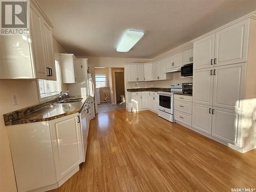 124 3Rd Street E, Ponteix, SK - Indoor Photo Showing Kitchen With Double Sink