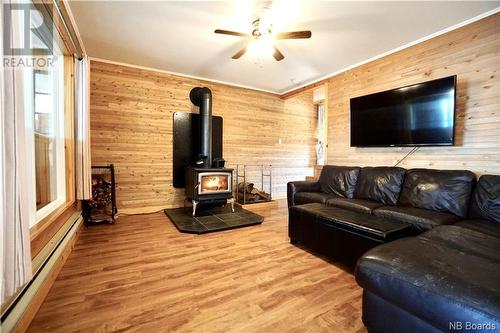 47 Old Schoolhouse Road, Rollingdam, NB - Indoor Photo Showing Living Room With Fireplace