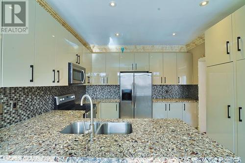 21 Castle Mountain Dr, Brampton, ON - Indoor Photo Showing Kitchen With Double Sink