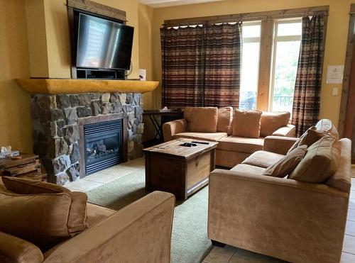 M3B - 1351 Gerry Sorensen Way, Kimberley, BC - Indoor Photo Showing Living Room With Fireplace
