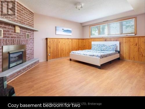 51 Beck Blvd, Penetanguishene, ON - Indoor Photo Showing Bedroom With Fireplace
