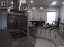 116 Emerald Ridge E, White City, SK  - Indoor Photo Showing Kitchen With Double Sink 