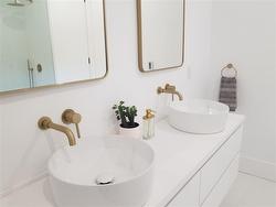 Ensuite, double vessel sinks, mirrors, cabinets - 