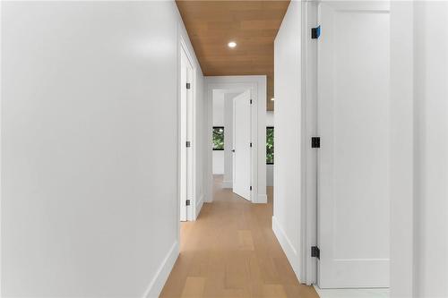 Upper hallway. Pot lighting. White oak flooring and ceiling. - 5427 Anthony Place, Burlington, ON - Indoor Photo Showing Other Room