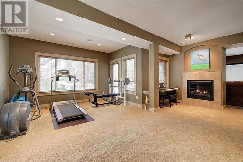 324 Quilchena Drive, Kelowna, BC - Indoor Photo Showing Gym Room With Fireplace