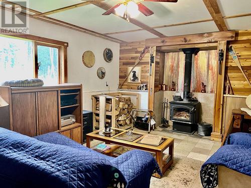 4509 Shaw Drive, Forest Grove, BC - Indoor Photo Showing Bedroom With Fireplace