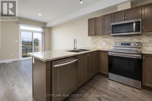 164 Dr Richard James Cres, Loyalist, ON - Indoor Photo Showing Kitchen With Double Sink