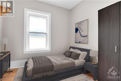 This photo has been virtually staged. - 154-156 Beckwith Street N, Smiths Falls, ON - Indoor Photo Showing Bedroom