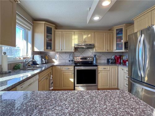 273 Pilling Drive, Brandon, MB - Indoor Photo Showing Kitchen With Stainless Steel Kitchen With Double Sink