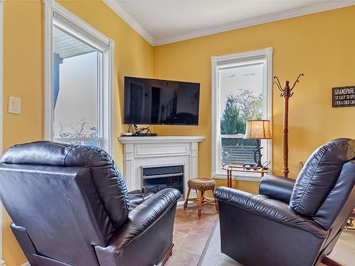 8337 Okanagan Landing Road, Vernon, BC - Indoor Photo Showing Living Room With Fireplace