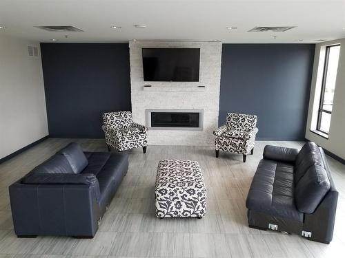 2305 2260 Sleeping Giant Parkway, Thunder Bay, ON - Indoor Photo Showing Living Room With Fireplace