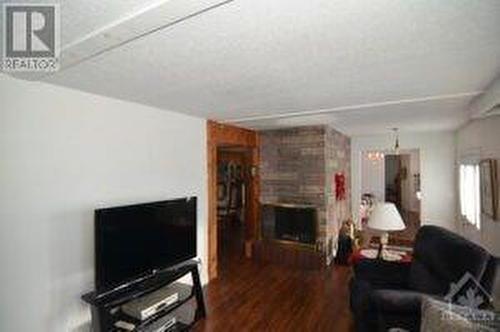 3555 Innes Road, Orleans, ON - Indoor Photo Showing Living Room With Fireplace