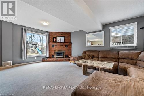 37 Farmington Drive, St. Catharines, ON - Indoor Photo Showing Living Room With Fireplace
